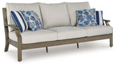 Best Deals Furniture - Ashley Furniture - Rainier Ranch Outdoor Sofa with Cushion - Sofa with Cushion / Brown/Beige - P701-838