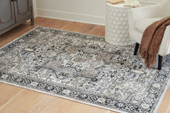 Best Deals Furniture - Ashley Furniture - Gregmoore 5'2" x 6'10" Washable Rug - 5'2" x 6'10" Washable Rug / Multi - R405822