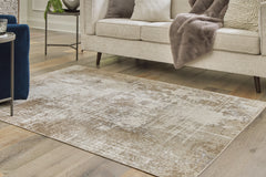 Best Deals Furniture - Ashley Furniture - Grifflain 5'1" x 7' Washable Rug - 5'1" x 7' Washable Rug / Tan/Brown/Gray - R406232