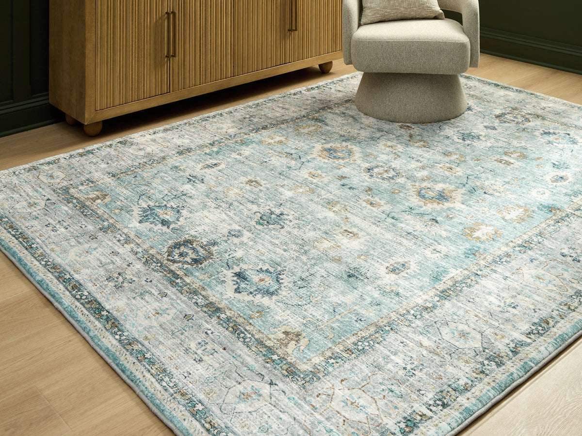 Best Deals Furniture - Ashley Furniture - Ladstoney 7'6" x 9'6" Area Rug - 7'6" x 9'6" Area Rug / Teal/Beige/Ochre - R407501