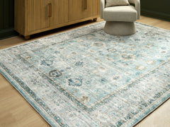 Best Deals Furniture - Ashley Furniture - Ladstoney 7'6" x 9'6" Area Rug - 7'6" x 9'6" Area Rug / Teal/Beige/Ochre - R407501