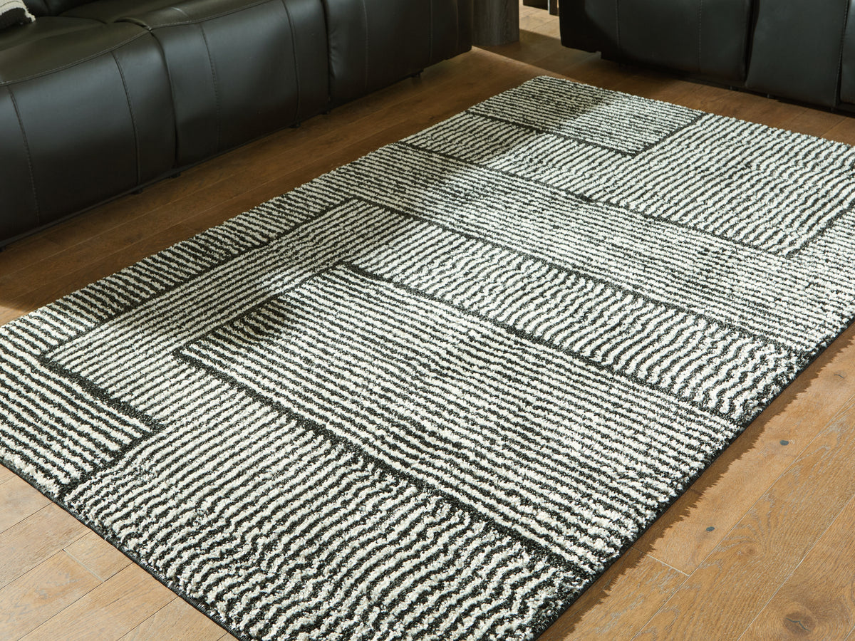 Best Deals Furniture - Ashley Furniture - Kurtmen 5' x 7' Area Rug - 5' x 7' Area Rug / Black/Ivory - R407592