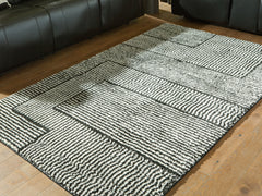 Best Deals Furniture - Ashley Furniture - Kurtmen 5' x 7' Area Rug - 5' x 7' Area Rug / Black/Ivory - R407592