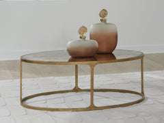 Best Deals Furniture - Ashley Furniture - Korajane Coffee Table - Oval Cocktail Table / Antique Gold - T399-0